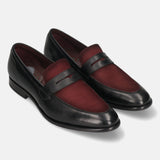 A black Men's bugatti Penny Loafer featuring a round toe apron toe, stacked heel. Made from premium genuine leather with a durable leather outsole, this slip-on design offers both style and comfort.