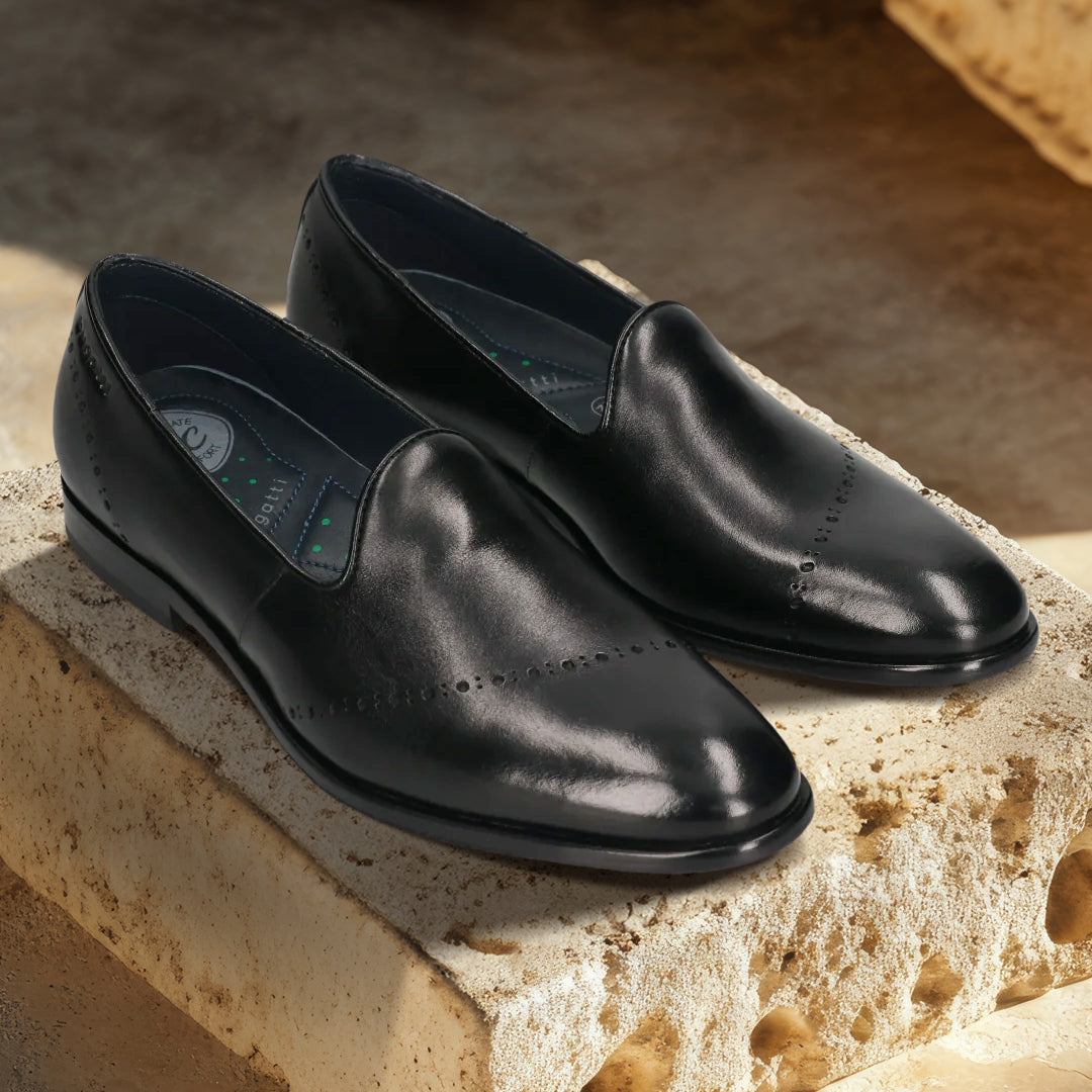 A black Men's bugatti Venetian Loafers featuring a round toe plain toe, stacked heel. Made from premium genuine leather with a durable leather outsole, this slip-on design offers both style and comfort.
