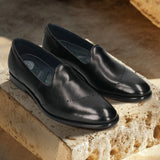 A black Men's bugatti Venetian Loafers featuring a round toe plain toe, stacked heel. Made from premium genuine leather with a durable leather outsole, this slip-on design offers both style and comfort.