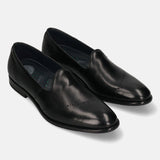 A black Men's bugatti Venetian Loafers featuring a round toe plain toe, stacked heel. Made from premium genuine leather with a durable leather outsole, this slip-on design offers both style and comfort.