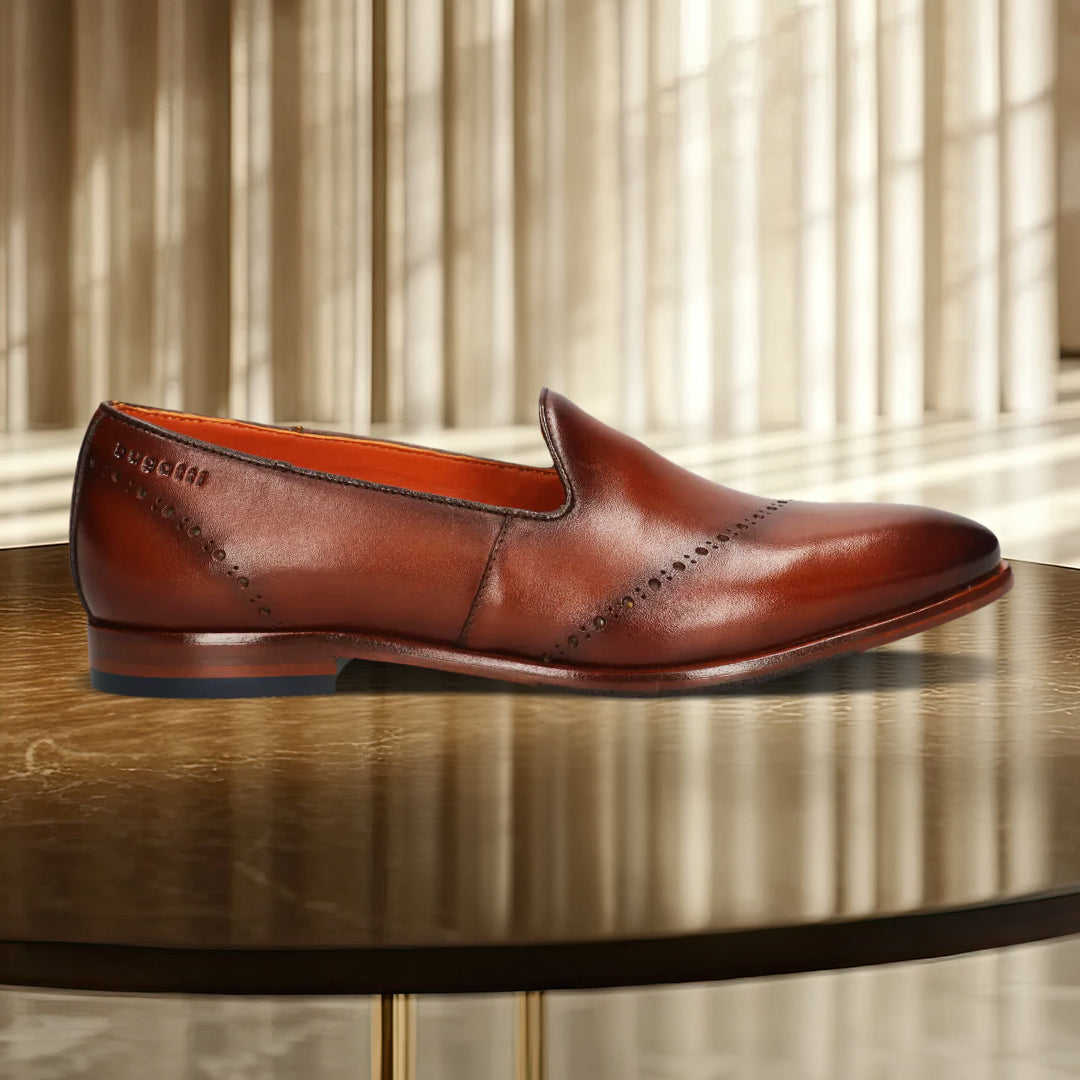 A cognac Men's bugatti Venetian Loafers featuring a round toe plain toe, stacked heel. Made from premium genuine leather with a durable leather outsole, this slip-on design offers both style and comfort.