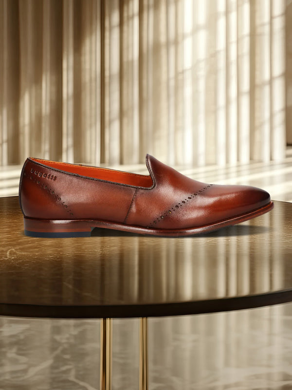 A cognac Men's bugatti Venetian Loafers featuring a round toe plain toe, stacked heel. Made from premium genuine leather with a durable leather outsole, this slip-on design offers both style and comfort.