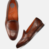 A cognac Men's bugatti Venetian Loafers featuring a round toe plain toe, stacked heel. Made from premium genuine leather with a durable leather outsole, this slip-on design offers both style and comfort.