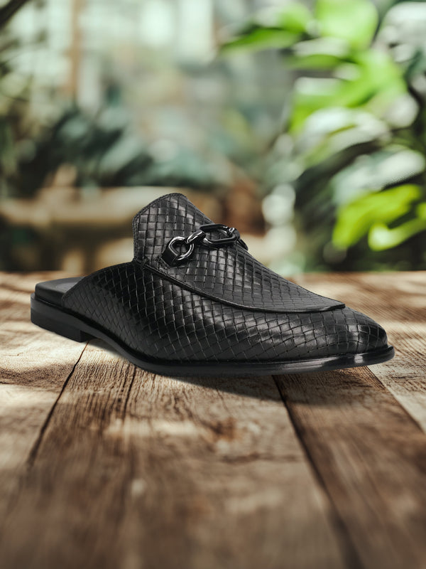 A black Men's bugatti Mules featuring a round toe apron toe, stacked heel. Made from premium genuine leather with a durable leather outsole, this slip-on design offers both style and comfort.