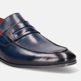 A blue Men's bugatti Penny Loafer featuring a round apron toe, moulded heel. Made from premium genuine leather with a durable high quality synthetic outsole, this slip-on design offers both style and comfort.