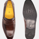 A brown Men's bugatti Penny Loafer featuring a round apron toe, moulded heel. Made from premium genuine leather with a durable high quality synthetic outsole, this slip-on design offers both style and comfort.
