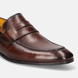 A brown Men's bugatti Penny Loafer featuring a round apron toe, moulded heel. Made from premium genuine leather with a durable high quality synthetic outsole, this slip-on design offers both style and comfort.