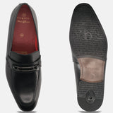 A black Men's bugatti Bit Loafer featuring a round toe apron toe, moulded heel. Made from premium genuine leather with a durable high quality synthetic outsole, this slip-on design offers both style and comfort.