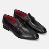 A black Men's bugatti Bit Loafer featuring a round toe apron toe, moulded heel. Made from premium genuine leather with a durable high quality synthetic outsole, this slip-on design offers both style and comfort.