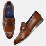 Men's Bugatti penny loafer cognac leather shoes with a round toe and apron toe featuring a moulded heel , a pvc outsole.