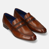 Men's Bugatti penny loafer cognac leather shoes with a round toe and apron toe featuring a moulded heel , a pvc outsole.