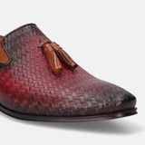 A grey Men's bugatti Tassel Loafers featuring a round toe plain toe, stacked heel. Made from premium genuine leather with a durable high quality synthetic outsole, this slip-on design offers both style and comfort.