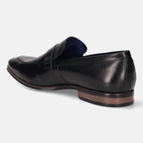 A black Men's bugatti Bit Loafer featuring a round toe apron toe, stacked heel. Made from premium genuine leather with a durable high quality synthetic outsole, this slip-on design offers both style and comfort.
