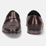 A brown Men's bugatti Bit Loafer featuring a round toe apron toe, stacked heel. Made from premium genuine leather with a durable high quality synthetic outsole, this slip-on design offers both style and comfort.