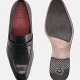 A black Men's bugatti Penny Loafer featuring a round toe apron toe, stacked heel. Made from premium genuine leather with a durable high quality synthetic outsole, this slip-on design offers both style and comfort.
