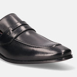 A black Men's bugatti Penny Loafer featuring a round toe apron toe, stacked heel. Made from premium genuine leather with a durable high quality synthetic outsole, this slip-on design offers both style and comfort.