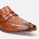 A cognac Men's bugatti Penny Loafer featuring a round toe apron toe, stacked heel. Made from premium genuine leather with a durable high quality synthetic outsole, this slip-on design offers both style and comfort.