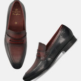A black Men's bugatti Penny Loafer featuring a round toe apron toe, moulded  heel. Made from premium genuine leather with a durable high quality synthetic outsole, this slip-on design offers both style and comfort.