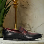 A black Men's bugatti Penny Loafer featuring a round toe apron toe, moulded  heel. Made from premium genuine leather with a durable high quality synthetic outsole, this slip-on design offers both style and comfort.