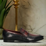A black Men's bugatti Penny Loafer featuring a round toe apron toe, moulded  heel. Made from premium genuine leather with a durable high quality synthetic outsole, this slip-on design offers both style and comfort.