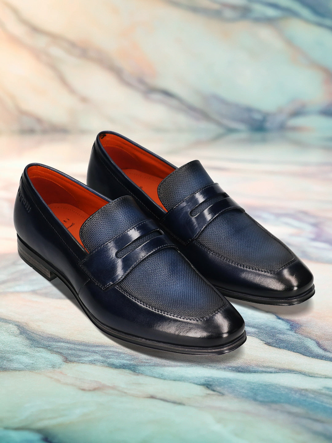 Men's Bugatti penny loafer blue leather shoes with a round toe and plain toe featuring a moulded heel , a pvc outsole.