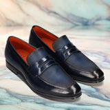 Men's Bugatti penny loafer blue leather shoes with a round toe and plain toe featuring a moulded heel , a pvc outsole.