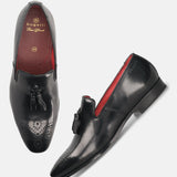 A black Men's bugatti Tassel Loafers featuring a round toe plain toe, moulded heel. Made from premium genuine leather with a durable high quality synthetic outsole, this slip-on design offers both style and comfort.
