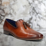 A cognac Men's bugatti Tassel Loafers featuring a round toe plain toe, moulded heel. Made from premium genuine leather with a durable high quality synthetic outsole, this slip-on design offers both style and comfort.