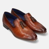 A cognac Men's bugatti Tassel Loafers featuring a round toe plain toe, moulded heel. Made from premium genuine leather with a durable high quality synthetic outsole, this slip-on design offers both style and comfort.