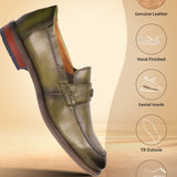 A green Men's bugatti Penny Loafer featuring a round apron toe, moulded heel. Made from premium genuine leather with a durable tr outsole, this slip-on design offers both style and comfort.