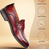 A grey Men's bugatti Penny Loafer featuring a round apron toe, moulded heel. Made from premium genuine leather with a durable tr outsole, this slip-on design offers both style and comfort.