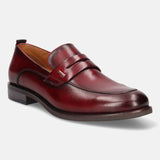 A grey Men's bugatti Penny Loafer featuring a round apron toe, moulded heel. Made from premium genuine leather with a durable tr outsole, this slip-on design offers both style and comfort.