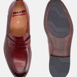 A grey Men's bugatti Penny Loafer featuring a round apron toe, moulded heel. Made from premium genuine leather with a durable tr outsole, this slip-on design offers both style and comfort.