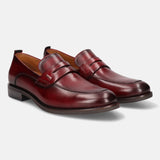 A grey Men's bugatti Penny Loafer featuring a round apron toe, moulded heel. Made from premium genuine leather with a durable tr outsole, this slip-on design offers both style and comfort.