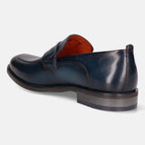 A blue Men's bugatti Penny Loafer featuring a round apron toe, moulded heel. Made from premium genuine leather with a durable tr outsole, this slip-on design offers both style and comfort.