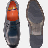 A blue Men's bugatti Penny Loafer featuring a round apron toe, moulded heel. Made from premium genuine leather with a durable tr outsole, this slip-on design offers both style and comfort.