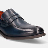 A blue Men's bugatti Penny Loafer featuring a round apron toe, moulded heel. Made from premium genuine leather with a durable tr outsole, this slip-on design offers both style and comfort.