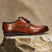 Men's Bugatti derby cognac leather shoes with a round toe and plain toe featuring a moulded heel , a tpr outsole , and laces fastening.