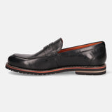 A black Men's bugatti Penny Loafer featuring a round apron toe, stacked heel, and a extra wide fit. Made from premium genuine leather with a durable eva outsole, this slip-on design offers both style and comfort.