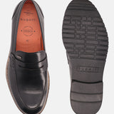 A black Men's bugatti Penny Loafer featuring a round apron toe, stacked heel, and a extra wide fit. Made from premium genuine leather with a durable eva outsole, this slip-on design offers both style and comfort.
