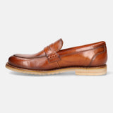 A cognac Men's bugatti Penny Loafer featuring a round apron toe, stacked heel, and a extra wide fit. Made from premium genuine leather with a durable eva outsole, this slip-on design offers both style and comfort.