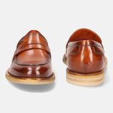 A cognac Men's bugatti Penny Loafer featuring a round apron toe, stacked heel, and a extra wide fit. Made from premium genuine leather with a durable eva outsole, this slip-on design offers both style and comfort.