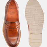 A cognac Men's bugatti Penny Loafer featuring a round apron toe, stacked heel, and a extra wide fit. Made from premium genuine leather with a durable eva outsole, this slip-on design offers both style and comfort.