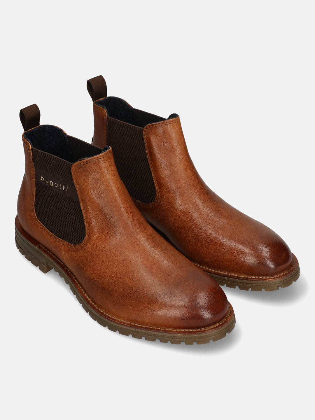 A cognac Men's bugatti Chelsea Boots featuring a round toe plain toe, moulded  heel, and a wide fit. Made from premium genuine leather with a durable tr outsole, this elastic design offers both style and comfort.