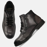 A grey Men's bugatti Ankle Boots featuring a round toe plain toe, moulded heel, and a wide fit. Made from premium genuine leather with a durable tr outsole, this zipper design offers both style and comfort.
