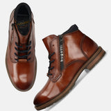 A cognac Men's bugatti Ankle Boots featuring a round toe plain toe, moulded heel, and a wide fit. Made from premium genuine leather with a durable tr outsole, this zipper design offers both style and comfort.