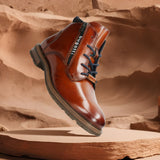 A cognac Men's bugatti Ankle Boots featuring a round toe plain toe, moulded heel, and a wide fit. Made from premium genuine leather with a durable tr outsole, this zipper design offers both style and comfort.
