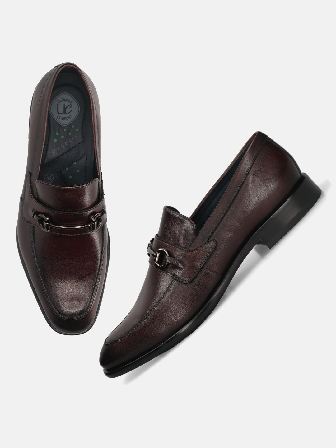 A grey Men's bugatti Bit Loafer featuring a round toe apron toe, stacked heel. Made from premium genuine leather with a durable leather outsole, this slip-on design offers both style and comfort.