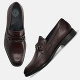 A grey Men's bugatti Bit Loafer featuring a round toe apron toe, stacked heel. Made from premium genuine leather with a durable leather outsole, this slip-on design offers both style and comfort.
