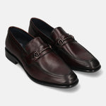 A grey Men's bugatti Bit Loafer featuring a round toe apron toe, stacked heel. Made from premium genuine leather with a durable leather outsole, this slip-on design offers both style and comfort.